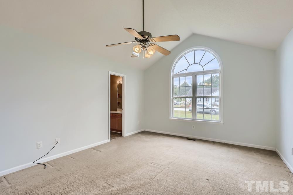 386 Rosa Circle Willow Spring, NC 27592 - Photo 11 of 27 a view of an empty room with a window