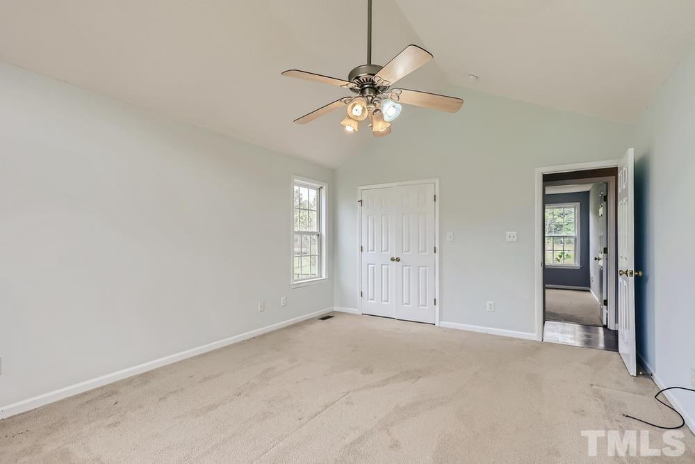 386 Rosa Circle Willow Spring, NC 27592 - Photo 13 of 27 a view of an empty room with a window