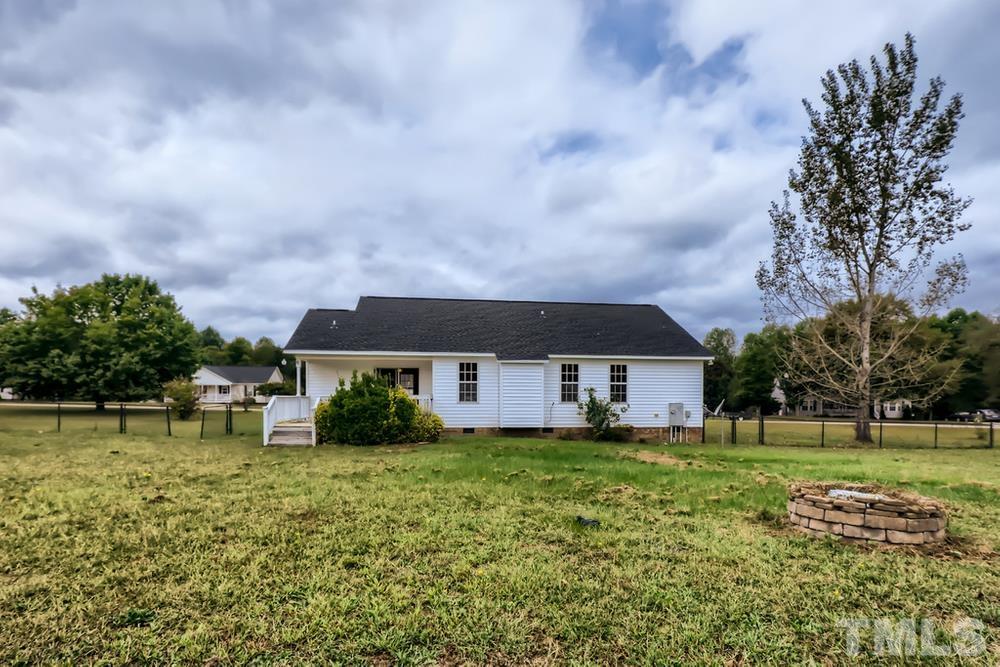 386 Rosa Circle Willow Spring, NC 27592 - Photo 26 of 27 a view of a house with a big yard and large trees