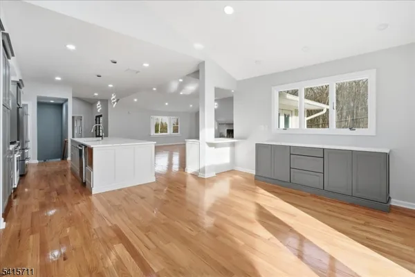a view of a kitchen with furniture and a kitchen