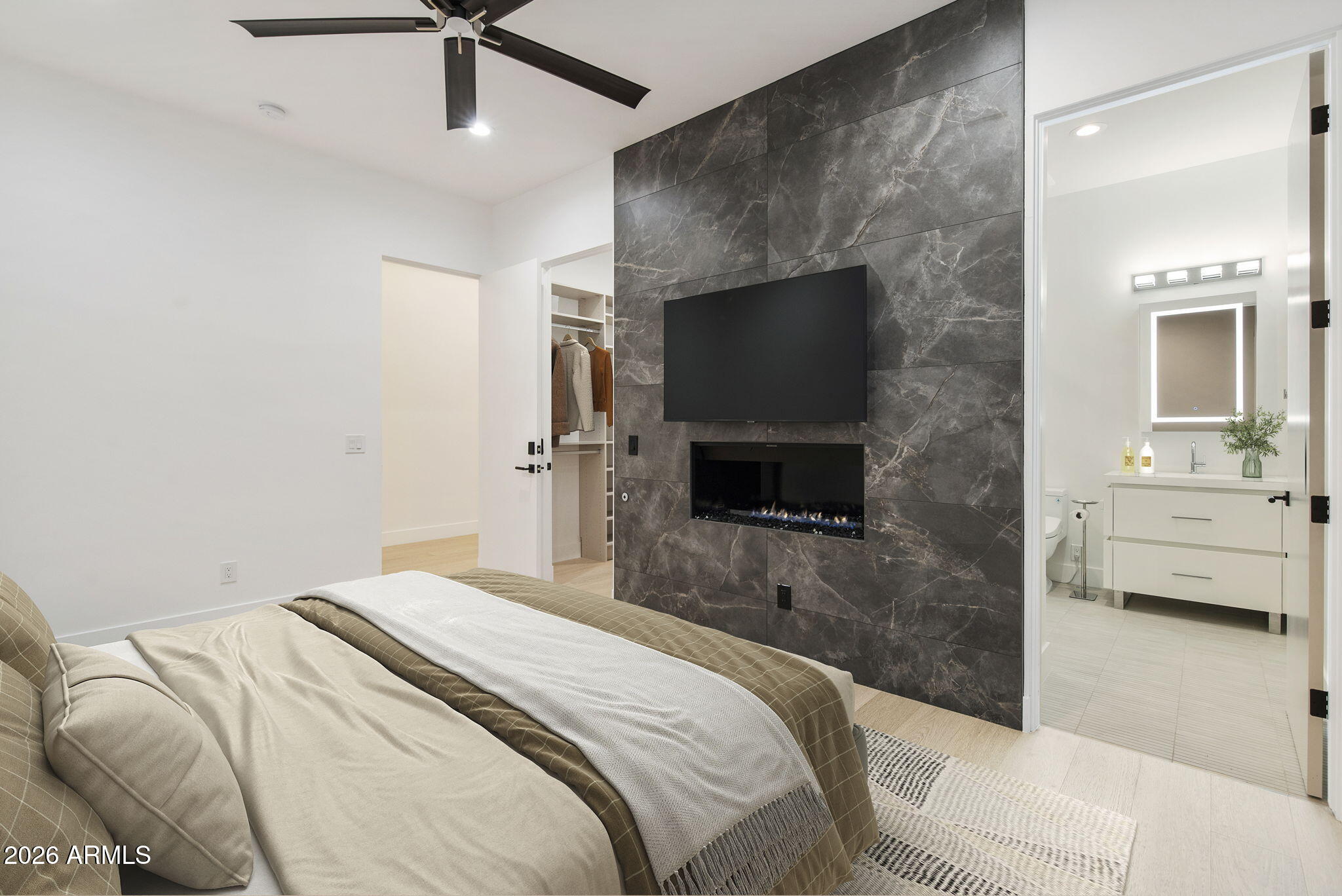 3035 East Coolidge Street Phoenix, AZ 85016 - Photo 18 of 40 a bedroom with a bed and a flat screen tv