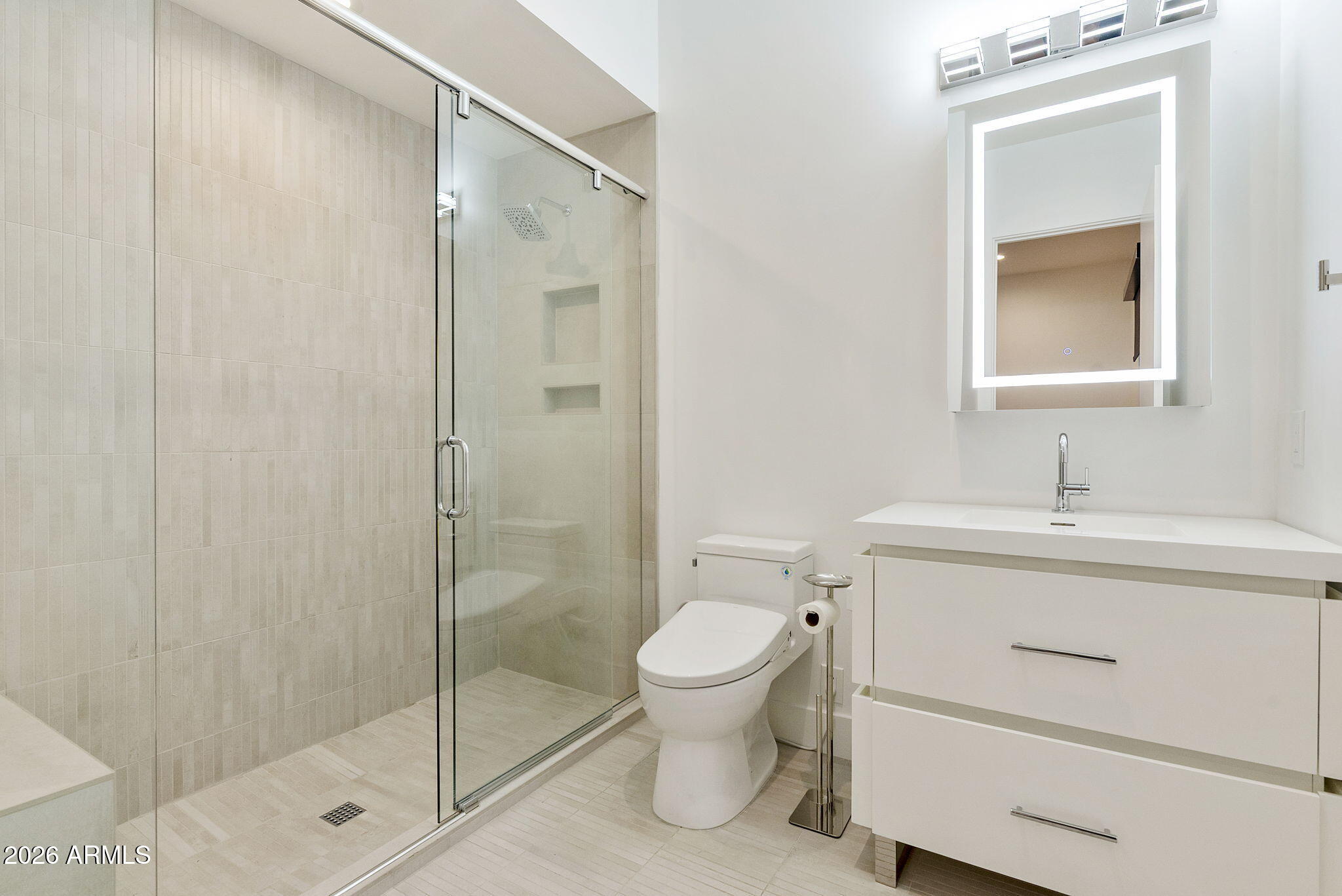 3035 East Coolidge Street Phoenix, AZ 85016 - Photo 19 of 40 a bathroom with a shower sink vanity mirror and toilet