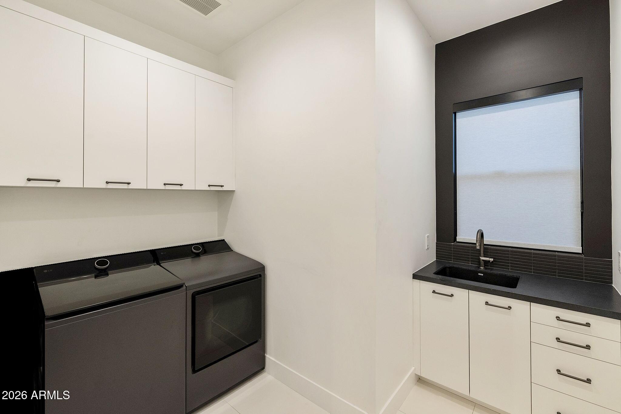 3035 East Coolidge Street Phoenix, AZ 85016 - Photo 21 of 40 a kitchen with a stove and a microwave