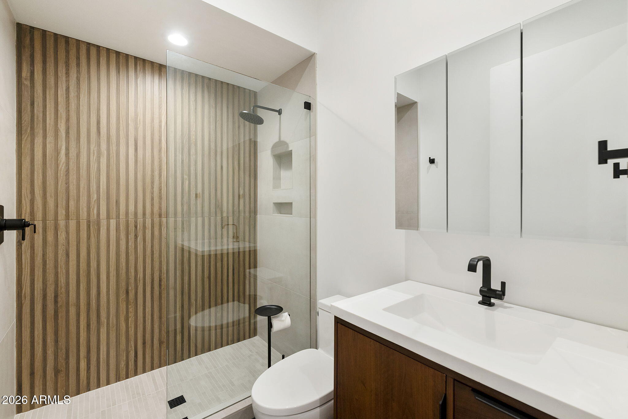 3035 East Coolidge Street Phoenix, AZ 85016 - Photo 23 of 40 a bathroom with a sink a toilet and shower