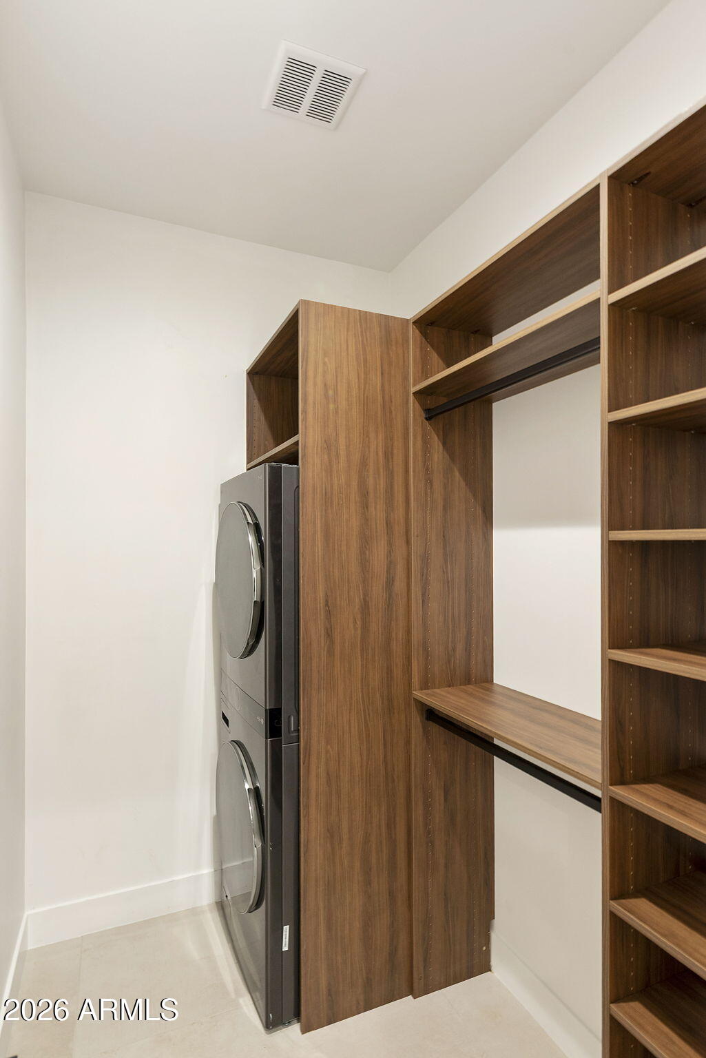 3035 East Coolidge Street Phoenix, AZ 85016 - Photo 24 of 40 a view of walk in closet with clothes and shoes