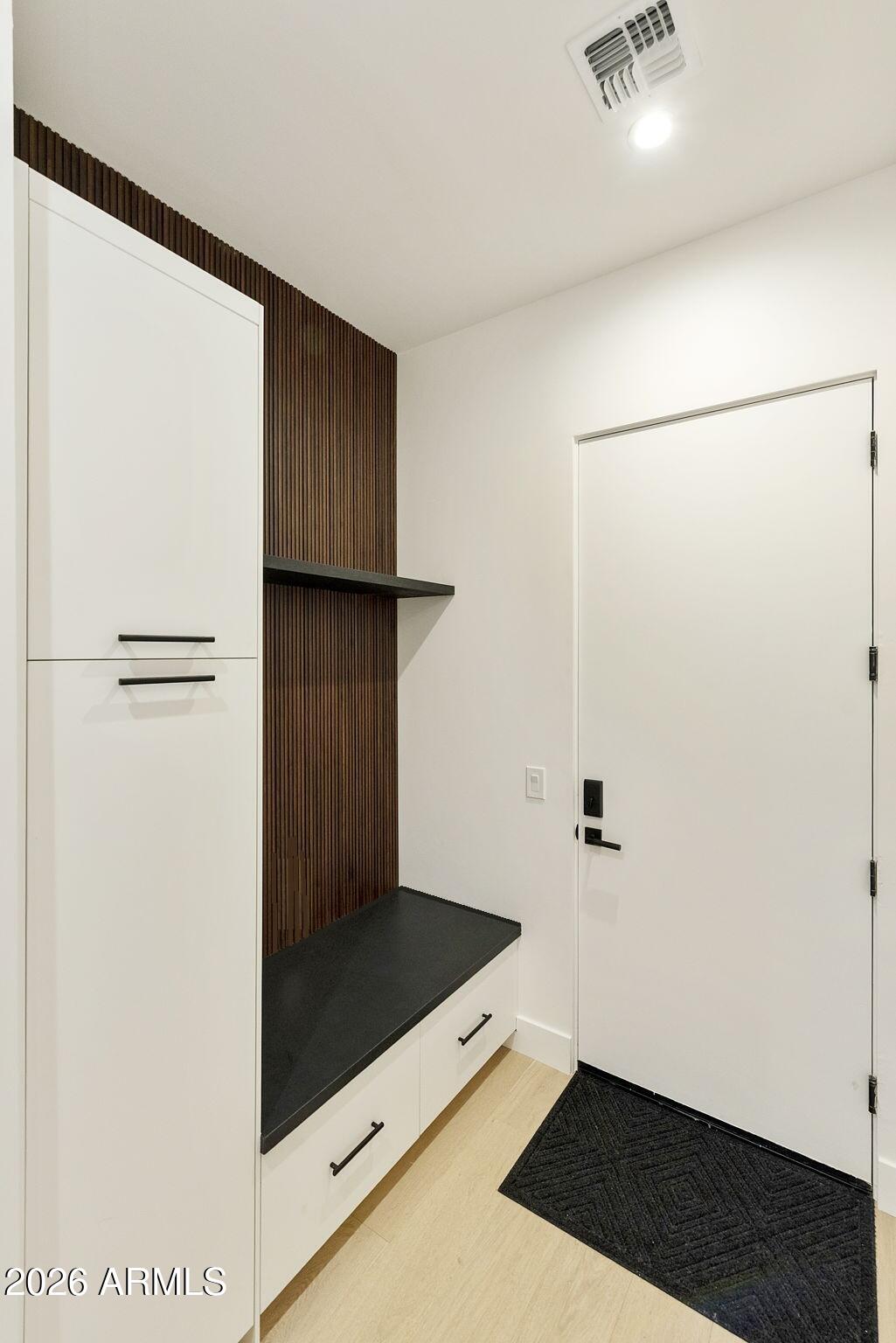 3035 East Coolidge Street Phoenix, AZ 85016 - Photo 27 of 40 a view of walk in closet with wooden floor