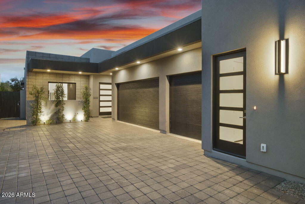 3035 East Coolidge Street Phoenix, AZ 85016 - Photo 29 of 40 a view of a hallway with wooden floor and door