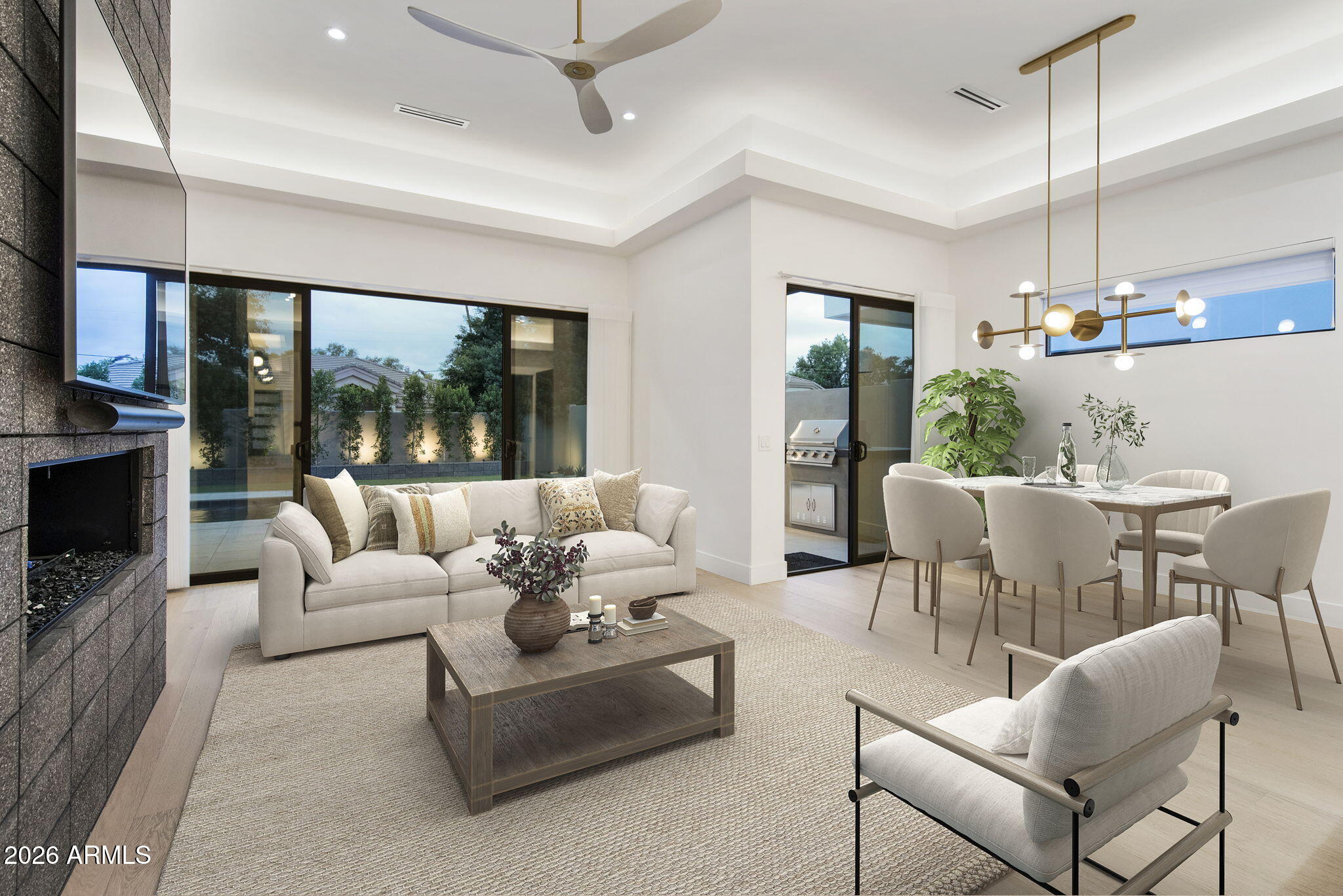 3035 East Coolidge Street Phoenix, AZ 85016 - Photo 2 of 40 a living room with furniture a flat screen tv and a large window