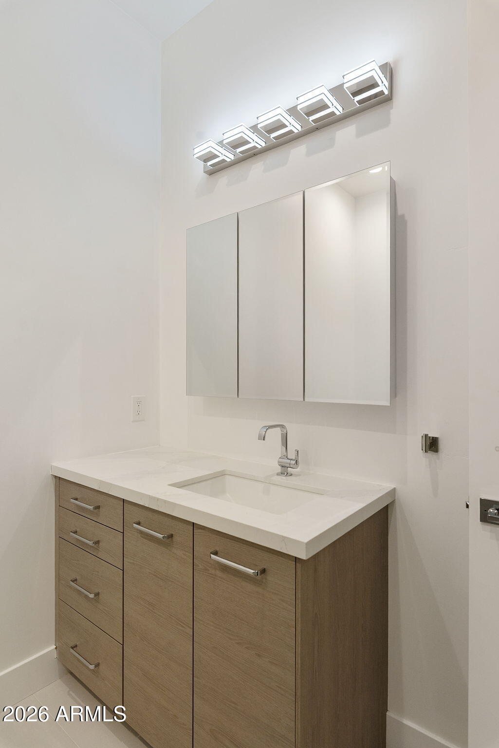 3035 East Coolidge Street Phoenix, AZ 85016 - Photo 33 of 40 a bathroom with a sink vanity and mirror