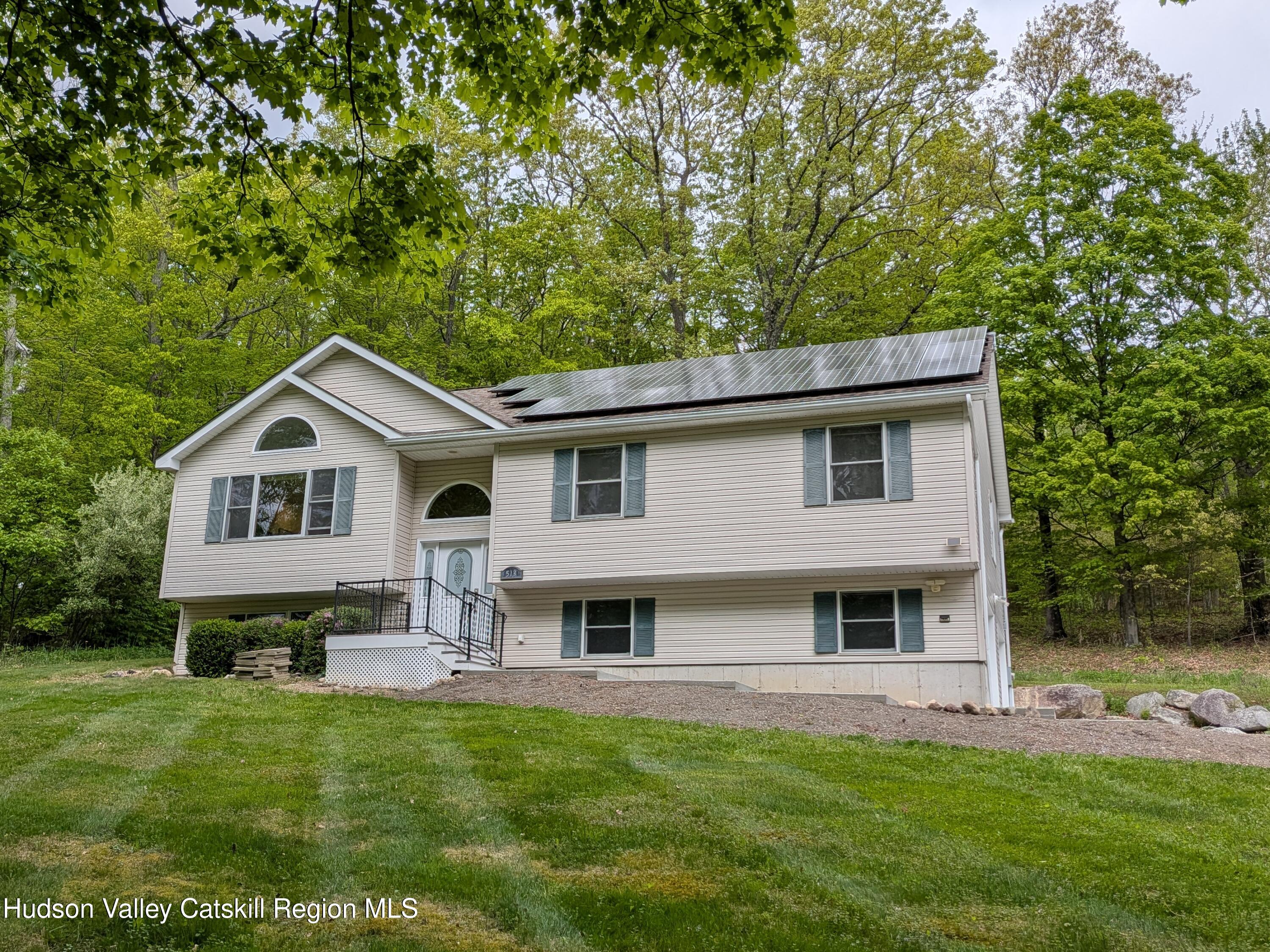 513 South Mountain Road Gardiner, NY 12525 - Photo 55 of 63 a front view of a house with a garden and yard