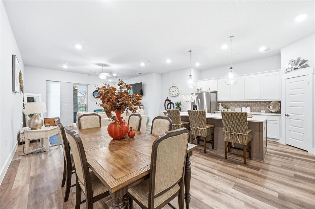 7236 Calistoga Lane Grand Prairie, TX 75054 - Photo 12 of 40 a dining room with furniture and wooden floor