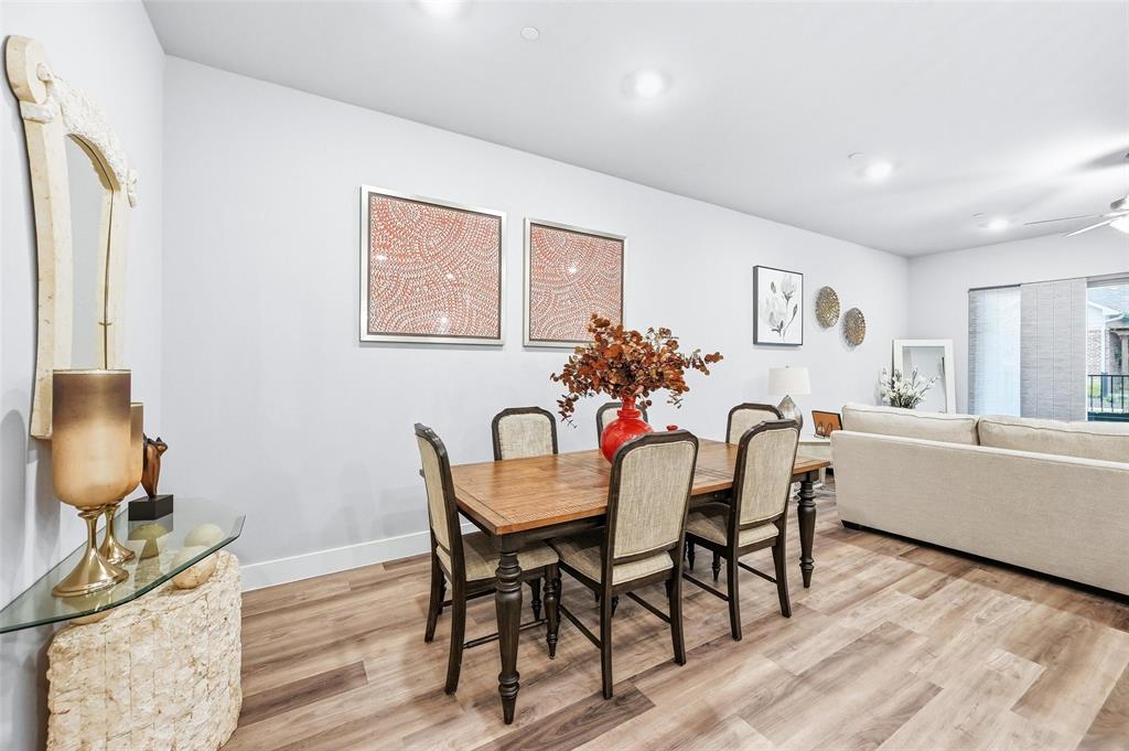 7236 Calistoga Lane Grand Prairie, TX 75054 - Photo 13 of 40 a view of a dining room with furniture and wooden floor