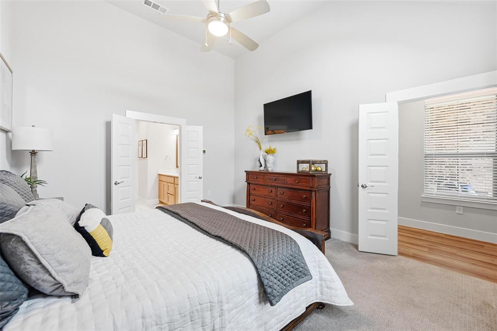 7236 Calistoga Lane Grand Prairie, TX 75054 - Photo 24 of 40 a bedroom with a bed and a flat screen tv