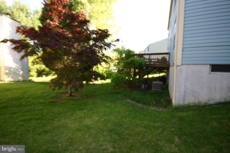 1345 Cavendish Drive Silver Spring, MD 20905 - Photo 2 of 23 Rear yard and deck viewed from side yard.
