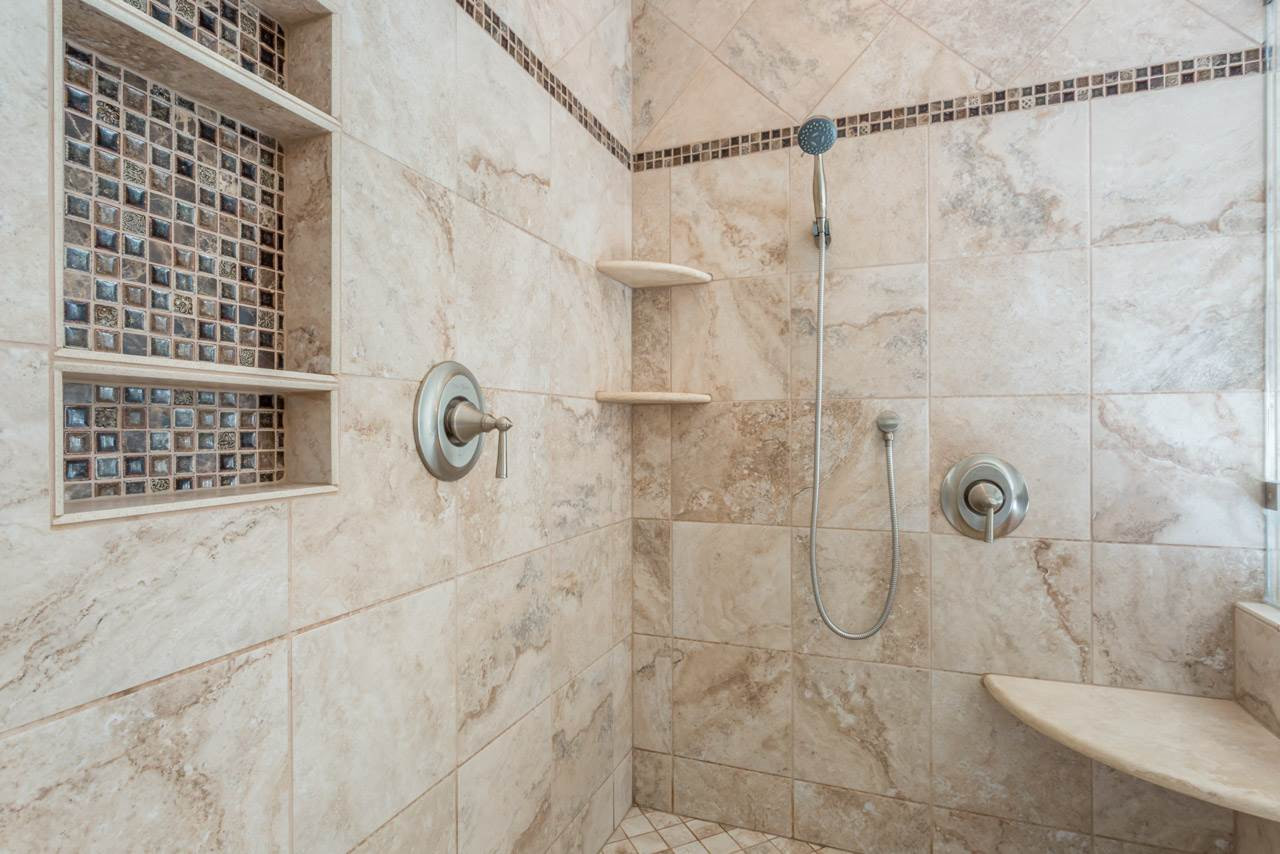 5600 Crossfield Drive Raleigh, NC 27613 - Photo 14 of 25 The large, seamless walk-in shower features custom tile surround with a large shampoo alcove and a corner seat. NEW Walk in Shower