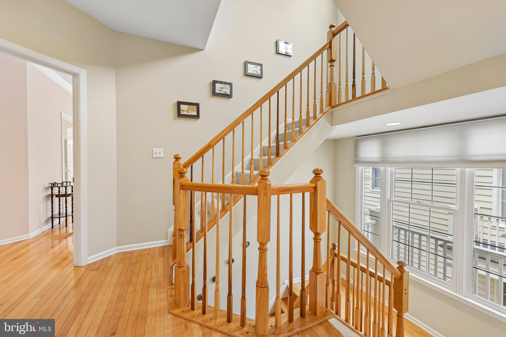 331 Alfandre Street Gaithersburg, MD 20878 - Photo 13 of 38 Inviting staircase with warm wood tones.