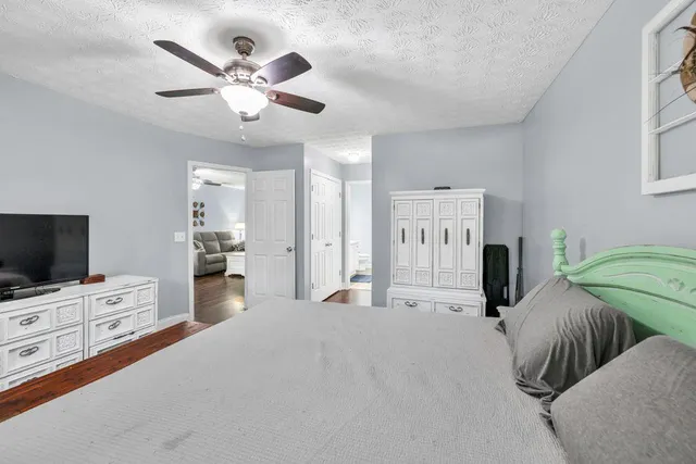 a bathroom with a sink vanity granite and toilet
