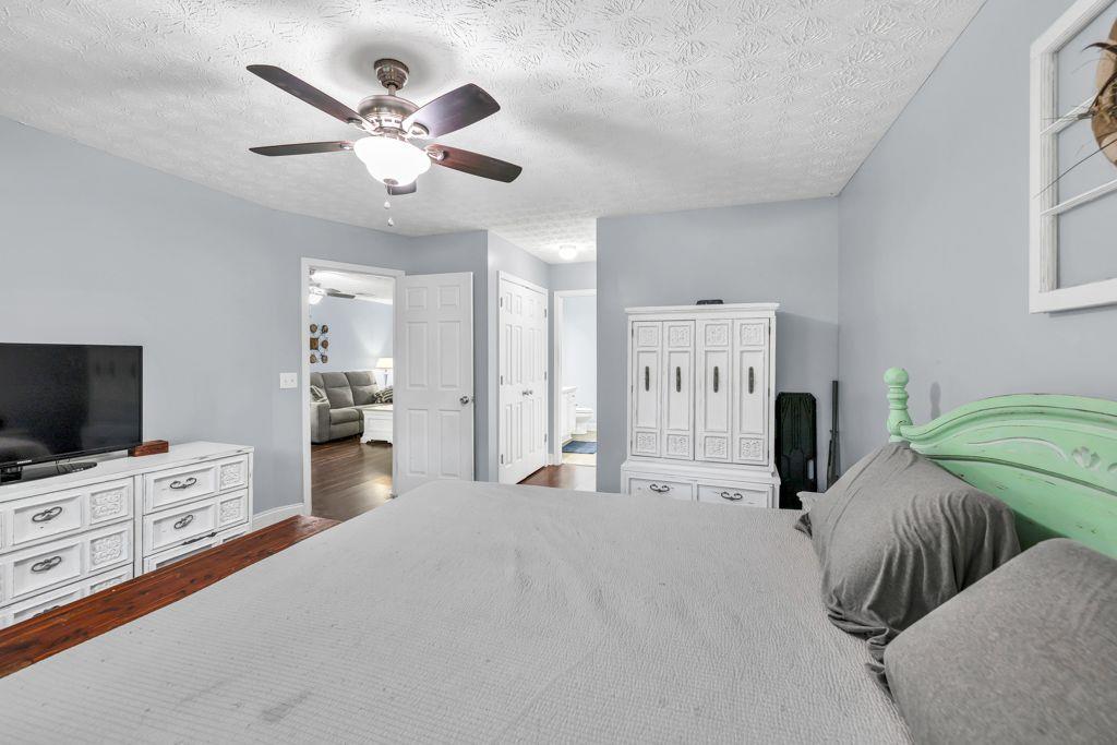 233 Tara Commons Walk Loganville, GA 30052 - Photo 24 of 52 a living room with furniture and a flat screen tv