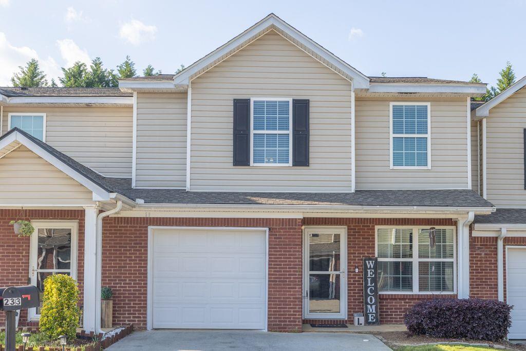 233 Tara Commons Walk Loganville, GA 30052 - Photo 3 of 52 a front view of a house