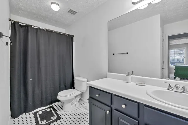 a view of a porch with chairs and backyard