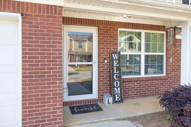 a view of a hallway with a white walls