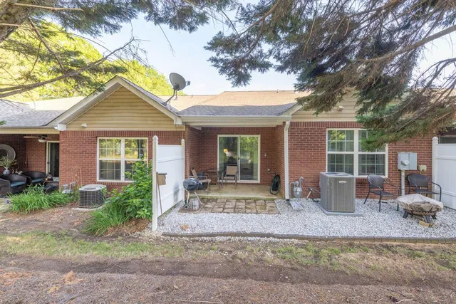 a backyard of a house with seating space