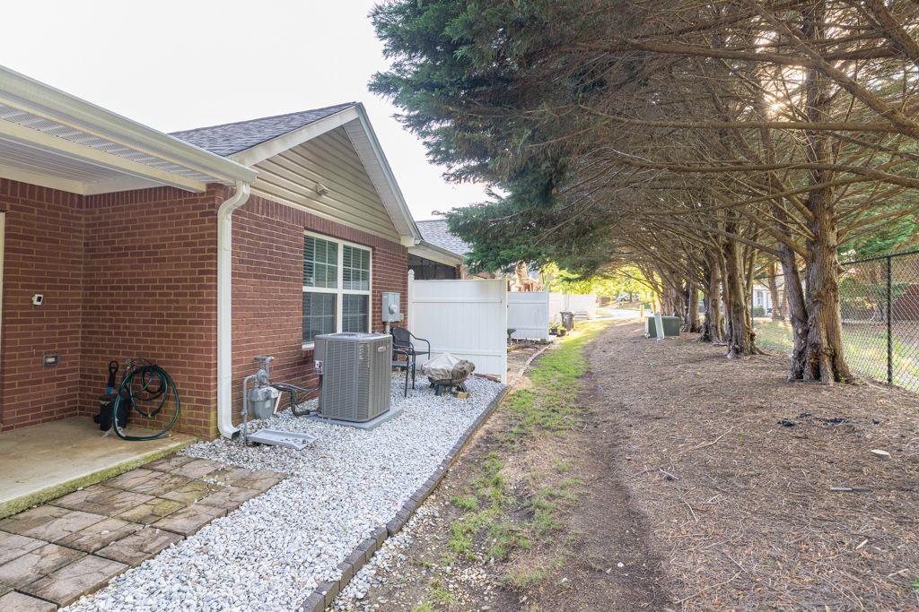 233 Tara Commons Walk Loganville, GA 30052 - Photo 44 of 52 a backyard of a house with barbeque oven and wooden fence