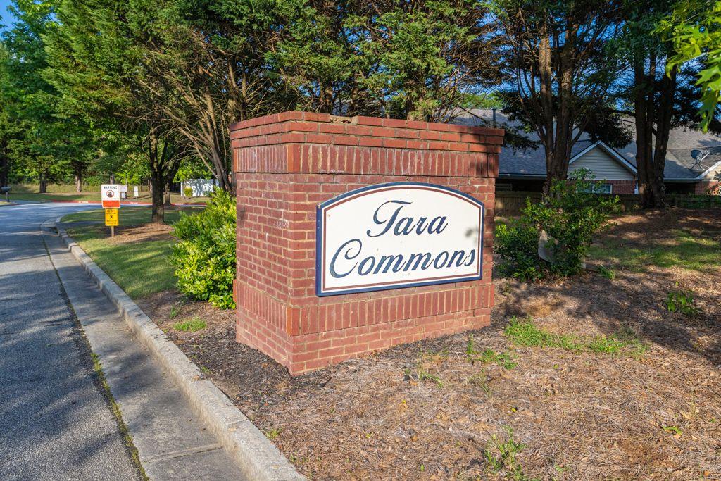 233 Tara Commons Walk Loganville, GA 30052 - Photo 45 of 52 a view of outdoor space with signage and flags