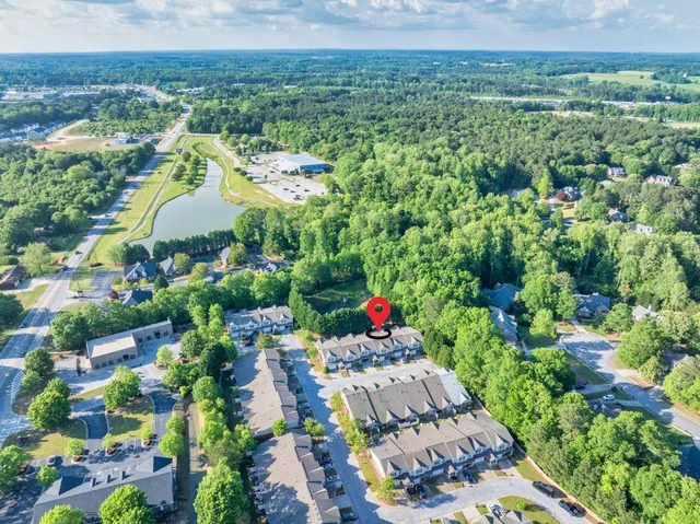 an aerial view of a house with a swimming pool