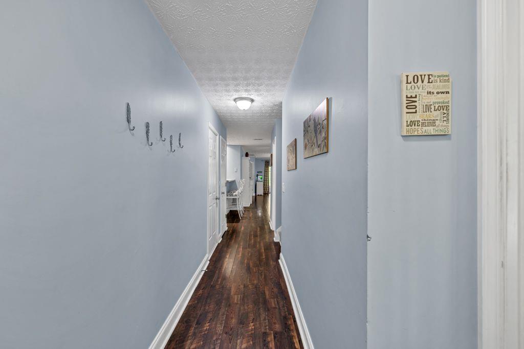 233 Tara Commons Walk Loganville, GA 30052 - Photo 5 of 52 a view of a hallway with a white walls