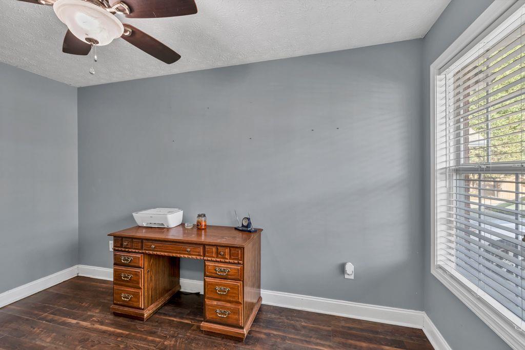 233 Tara Commons Walk Loganville, GA 30052 - Photo 6 of 52 a view of workspace with wooden floor