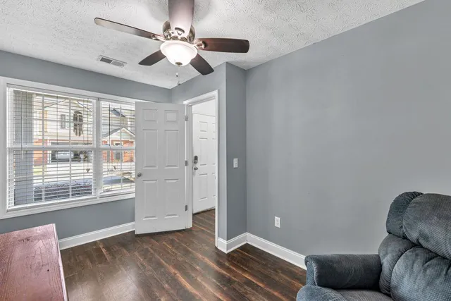 a living room with furniture and a rug