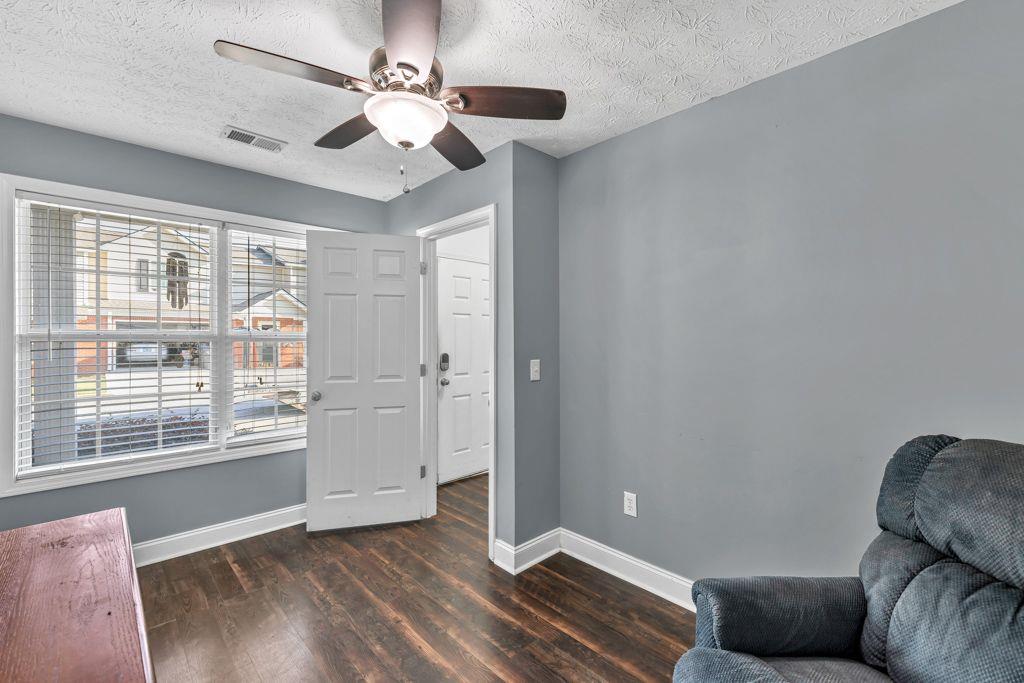 233 Tara Commons Walk Loganville, GA 30052 - Photo 7 of 52 a living room with furniture and a large window