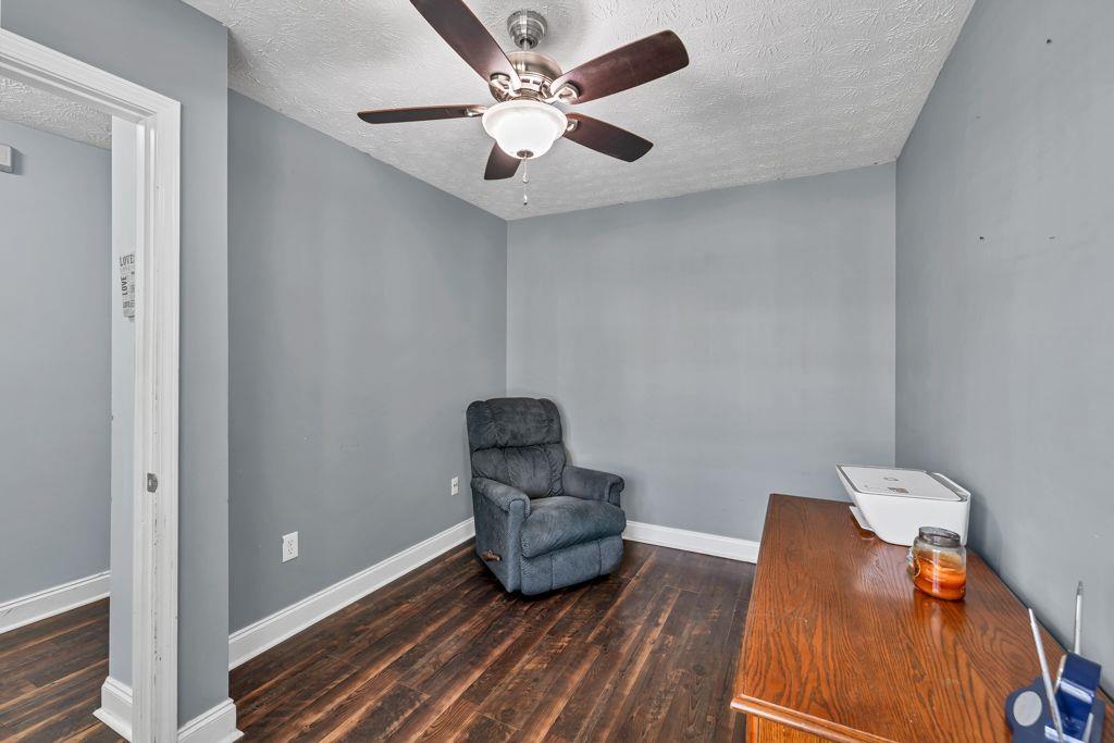 233 Tara Commons Walk Loganville, GA 30052 - Photo 8 of 52 a living room with furniture and a rug