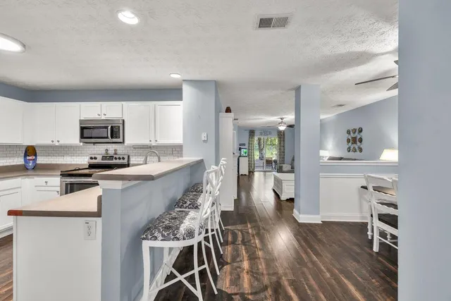 a kitchen with a table and chairs