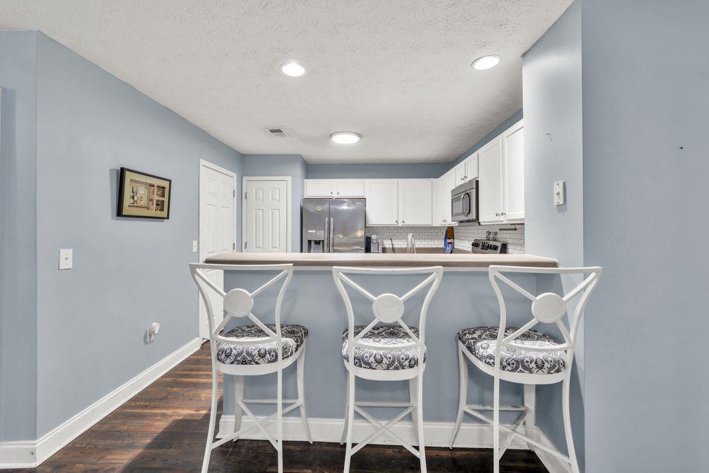 233 Tara Commons Walk Loganville, GA 30052 - Photo 10 of 52 a kitchen with a table and chairs
