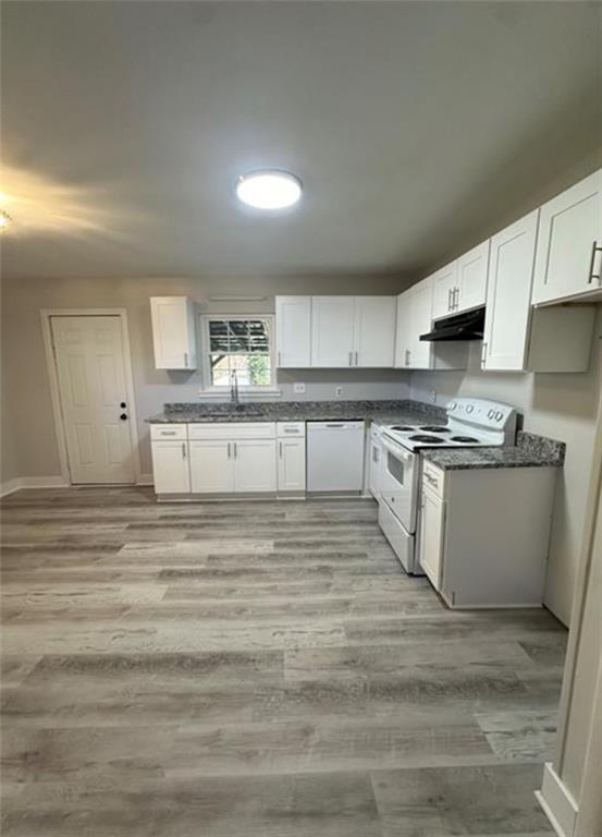 4510 Burks Road Forest Park, GA 30297 - Photo 3 of 8 a kitchen with stainless steel appliances granite countertop a stove a sink and a microwave