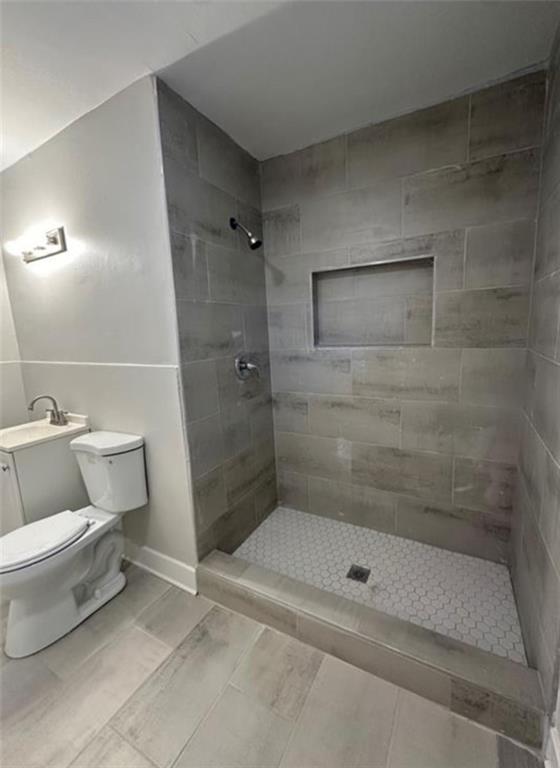 4510 Burks Road Forest Park, GA 30297 - Photo 7 of 8 a bathroom with a toilet and shower