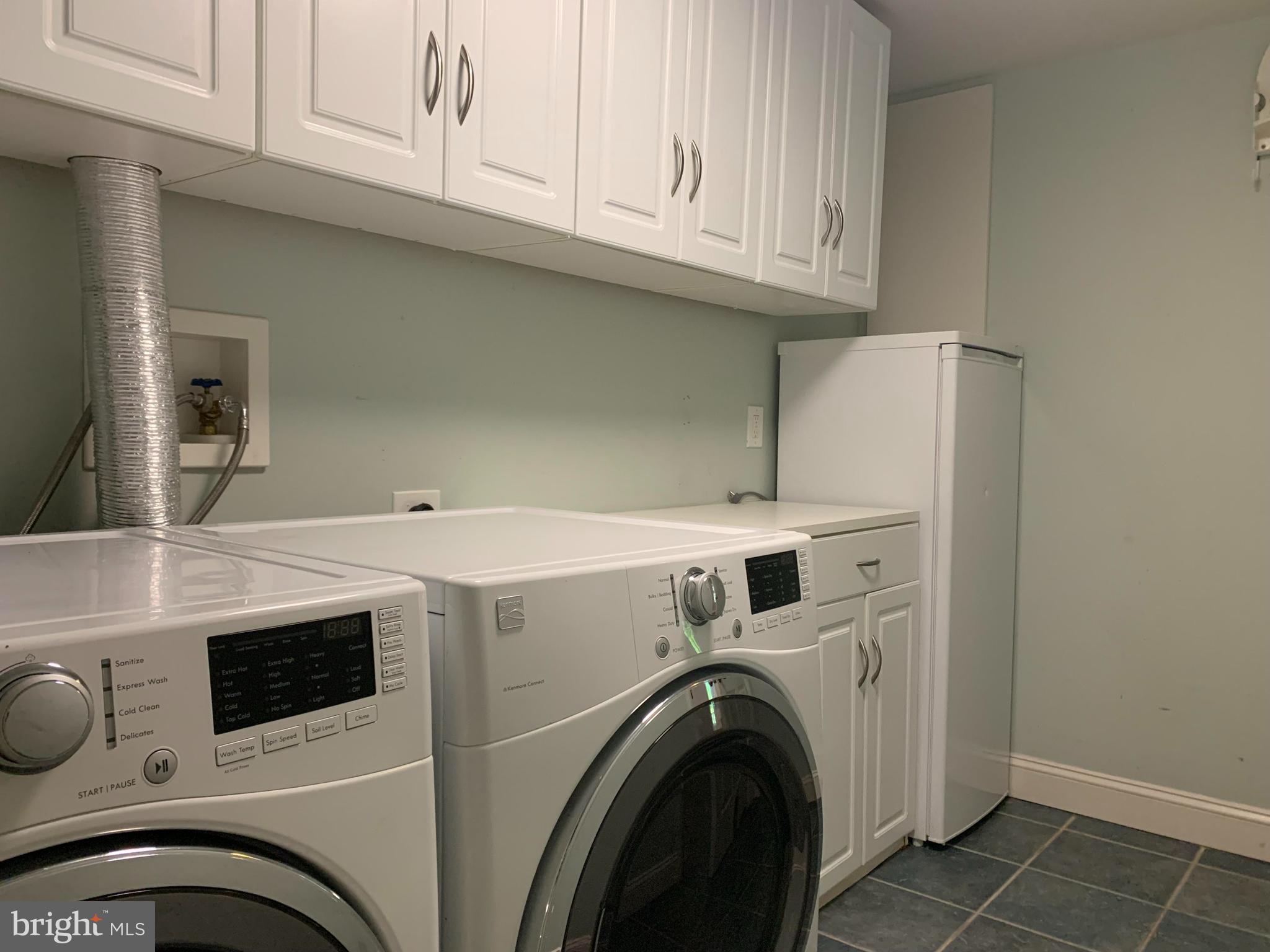 489 Woodhill Road Wayne, PA 19087 - Photo 36 of 48 Laundry with 2nd refrigerator and shelving