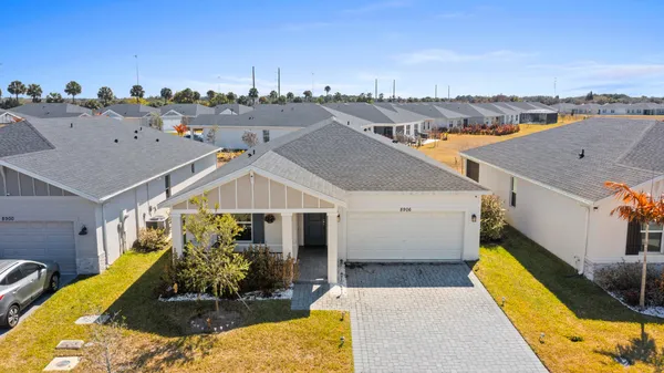an aerial view of a house with a swimming pool
