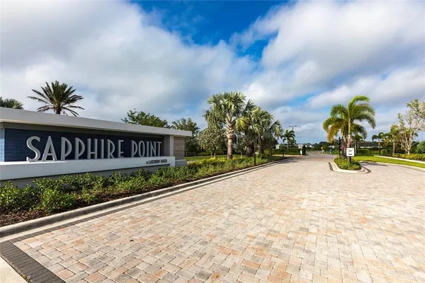 a view of swimming pool with an outdoor seating