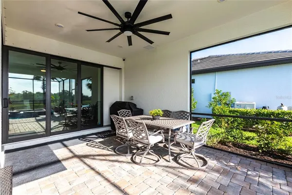 a view of swimming pool with a patio