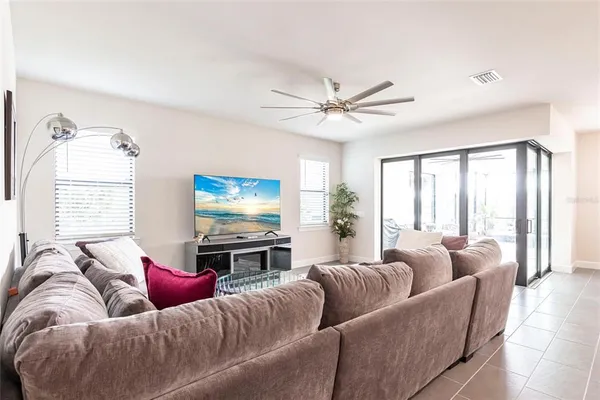 a living room with furniture and a large window