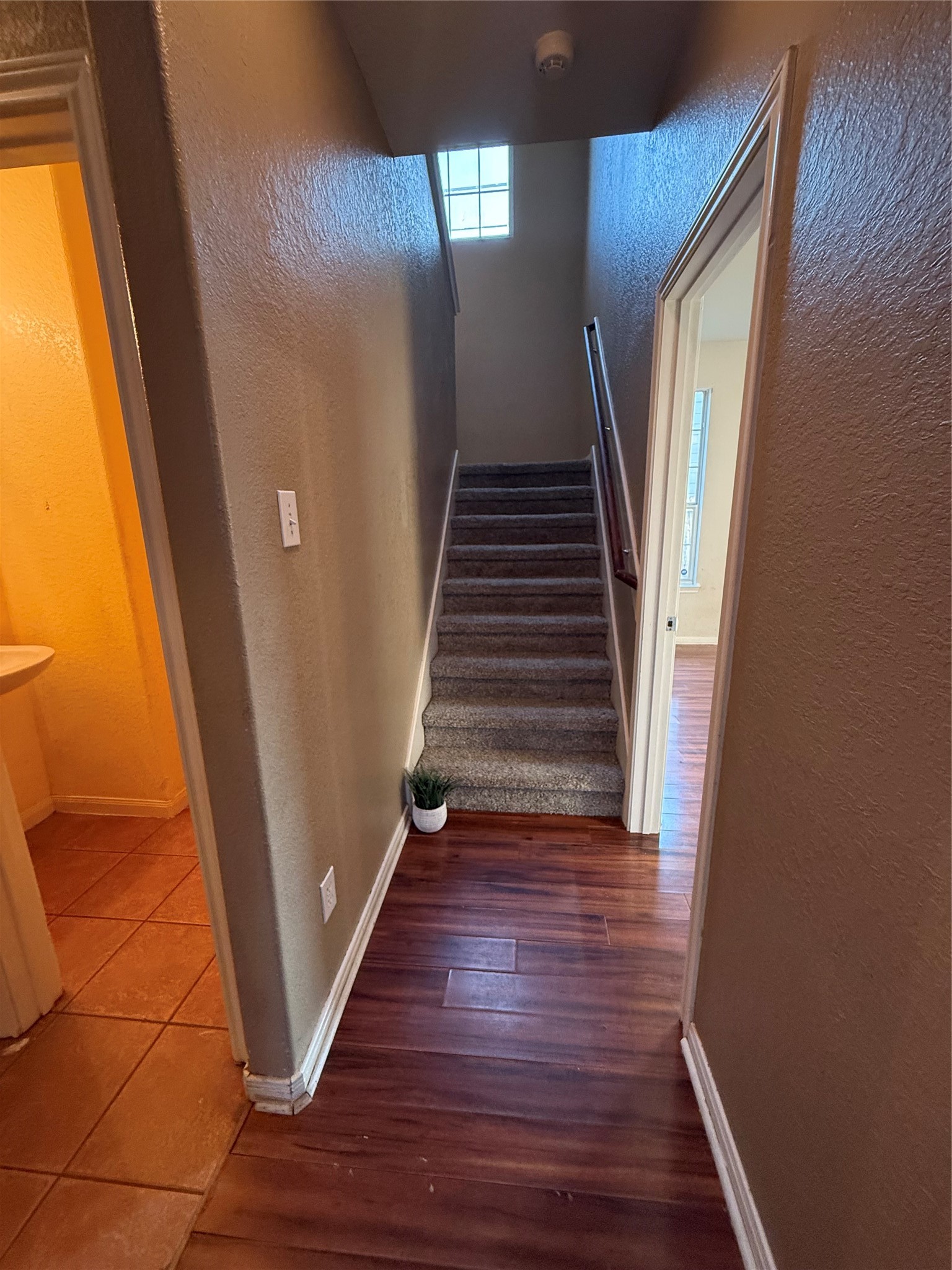 9429 Lambright Road Houston, TX 77075 - Photo 15 of 40 Walls and rigid hallways are minimized so rooms blend naturally into one another. Go right for the primary bedroom, or left for half-bath, garage, and laundry room access.