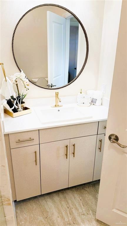 5302 Vision Street Rio Grande City, TX 78582 - Photo 13 of 19 view of a sink a mirror and cabinets in a room