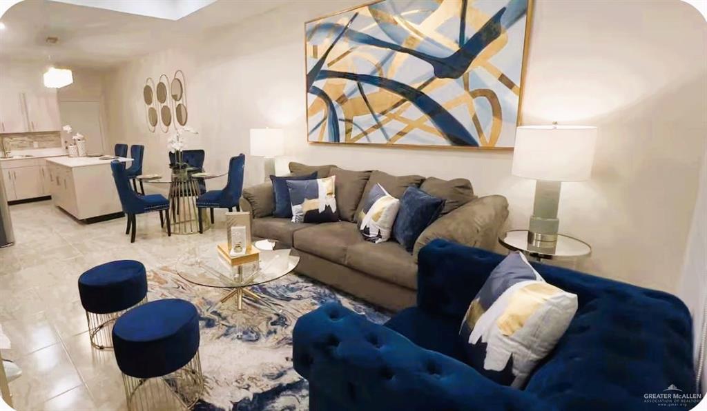 5302 Vision Street Rio Grande City, TX 78582 - Photo 19 of 19 a living room with furniture a rug and wall painting