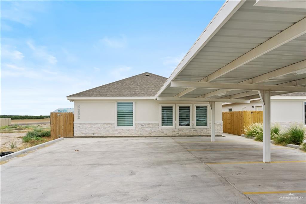 5302 Vision Street Rio Grande City, TX 78582 - Photo 2 of 19 a view of house with backyard and glass windows