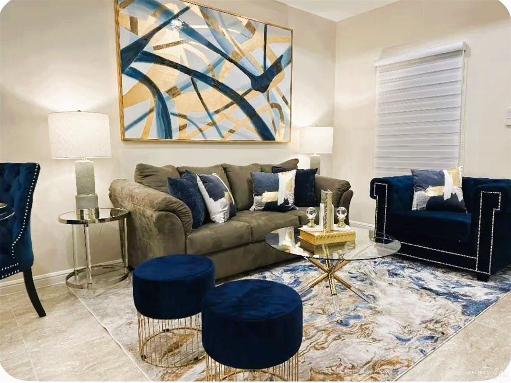 5302 Vision Street Rio Grande City, TX 78582 - Photo 4 of 19 a living room with furniture a couch and a window