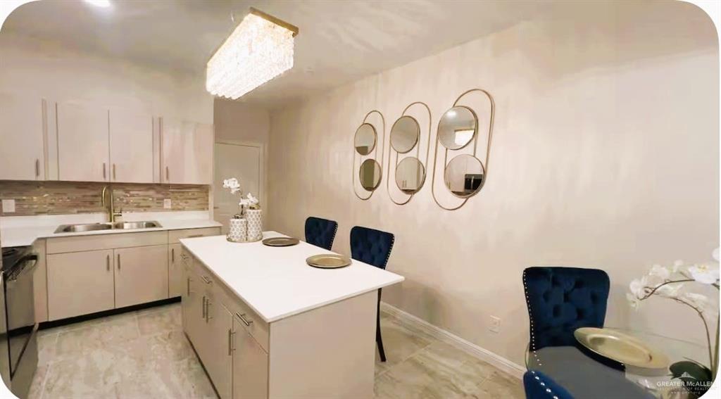 5302 Vision Street Rio Grande City, TX 78582 - Photo 8 of 19 a kitchen with a cabinets a sink and a stove top oven