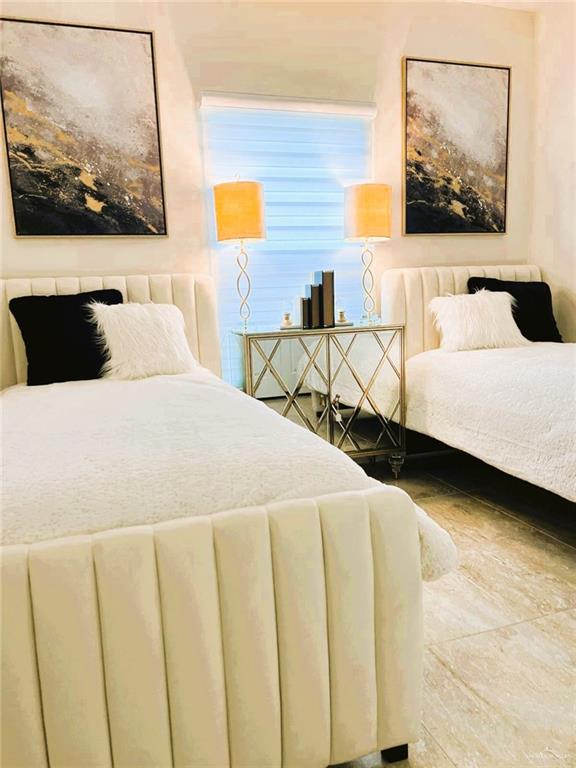 5302 Vision Street Rio Grande City, TX 78582 - Photo 10 of 19 a bedroom with a bed and wall painting